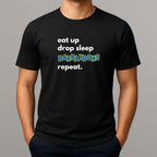 Black t-shirt with text 'eat up drop sleep BARBAYDOHS repeat.' on a gray background