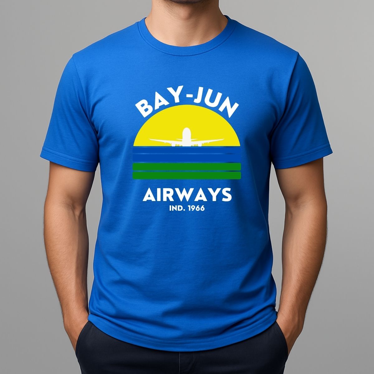 Person wearing a blue t-shirt with 'BAY-JUN AIRWAYS' design on a gray background