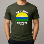Person wearing a green t-shirt with 'BAY-JUN AIRWAYS' design on a gray background