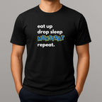 Person wearing  black t shirt with white tet