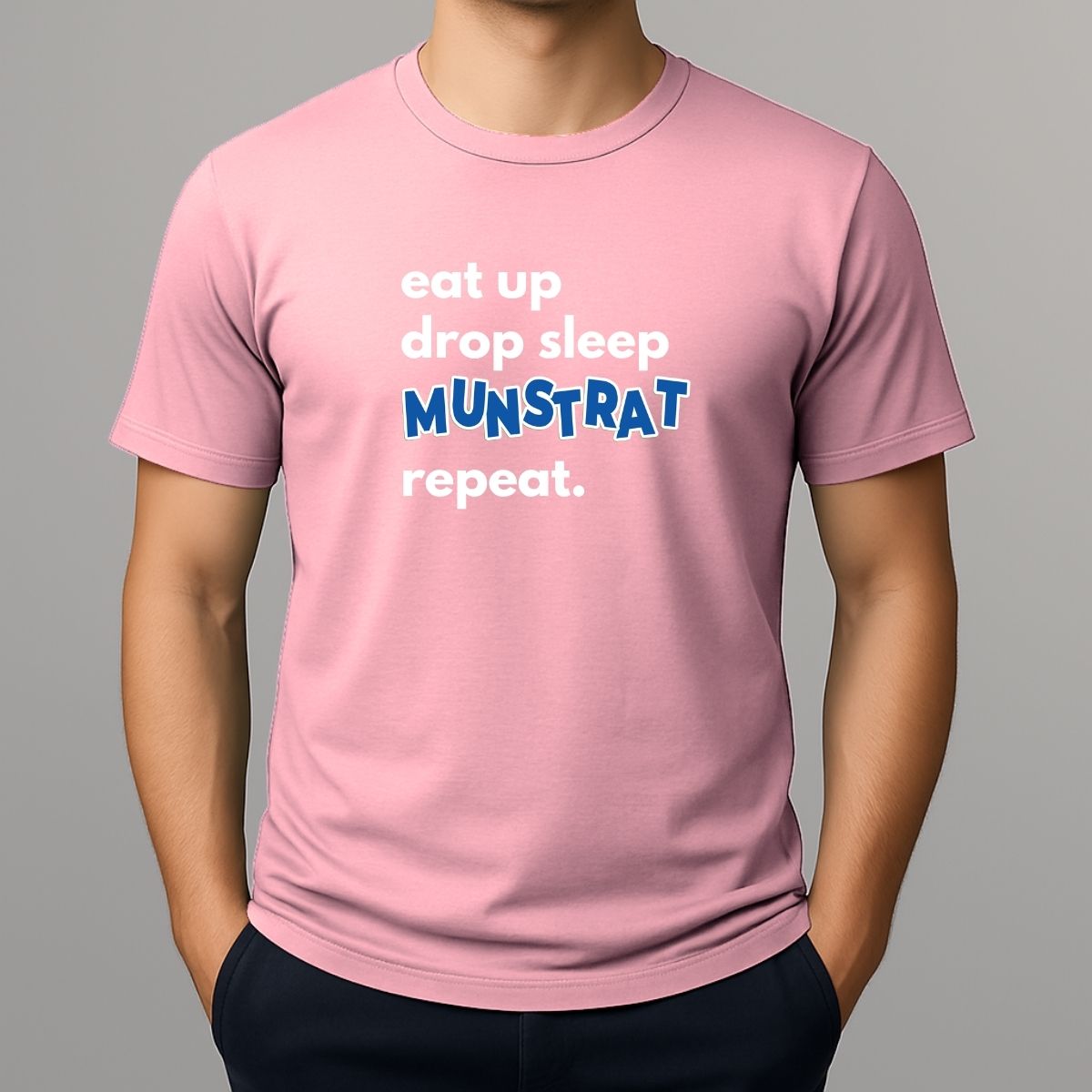 Person wearing pink t shirt with white text