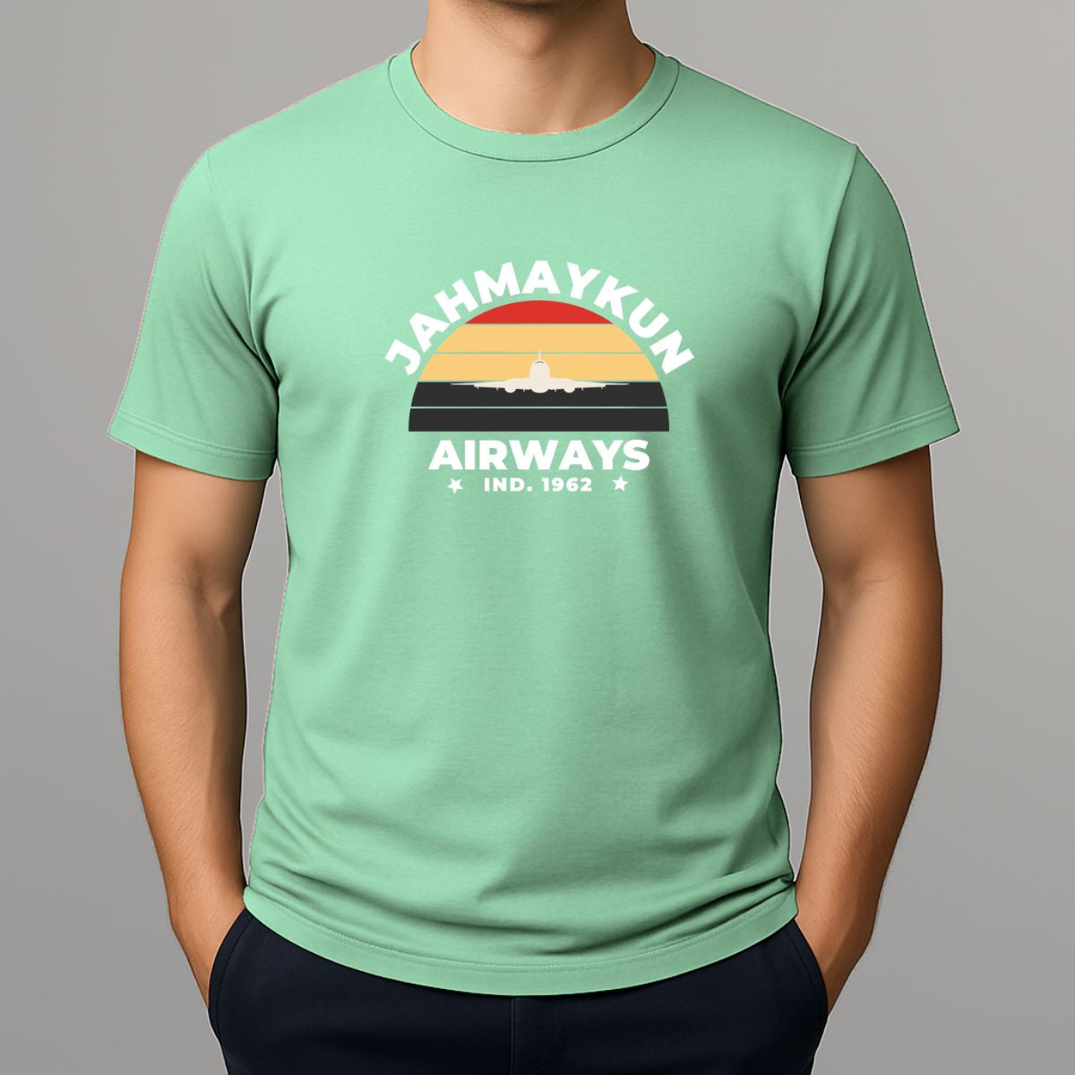 Person wearing a light green t shirt with JAHMAYKUN AIRWAYS design