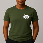 Person wearing a khaki green short-sleeve t-shirt with a comic style thought bubble on the left chest. Black text reads "MORE BLACKS, MORE DOGS, MORE IRISH".