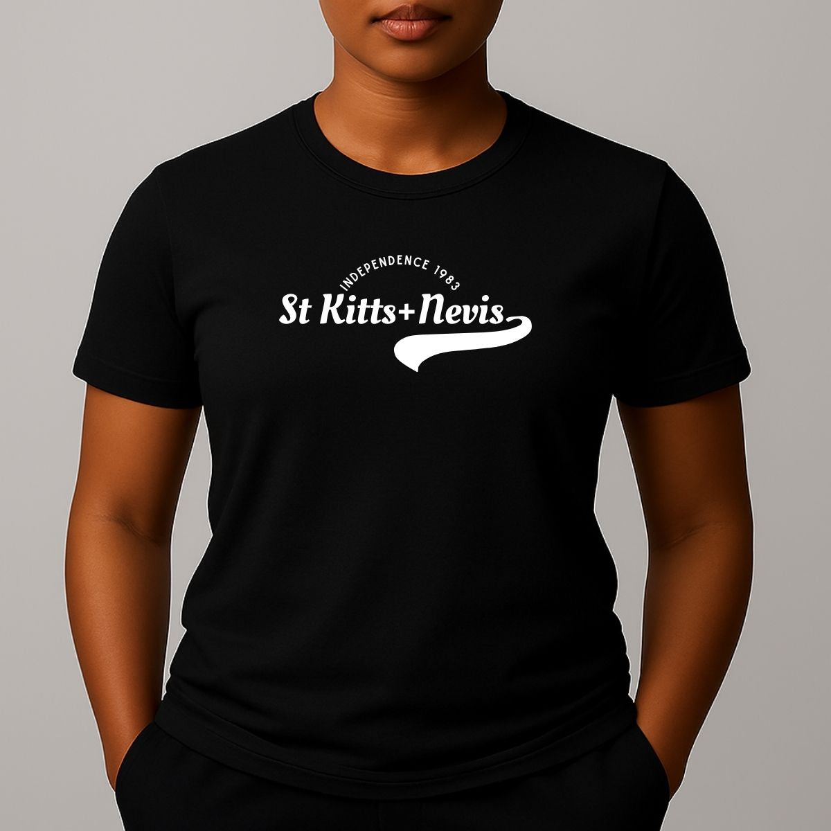 Person wearing a black short sleeve t-shirt with a white 'St Kitts+Nevis' graphic on the chest.