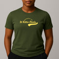 Person wearing a khaki green short sleeve t-shirt with a yellow 'St Kitts+Nevis' graphic on the chest.