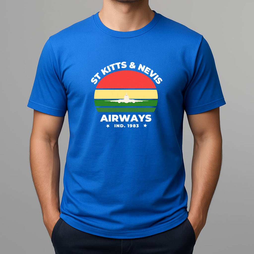 Person wearing a bright blue t-shirt with a graphic print on the chest, featuring the text 'ST KITTS & NEVIS AIRWAYS' in white, surrounding a circular flag design with red, yellow, and green horizontal bands and a white airplane silhouette.