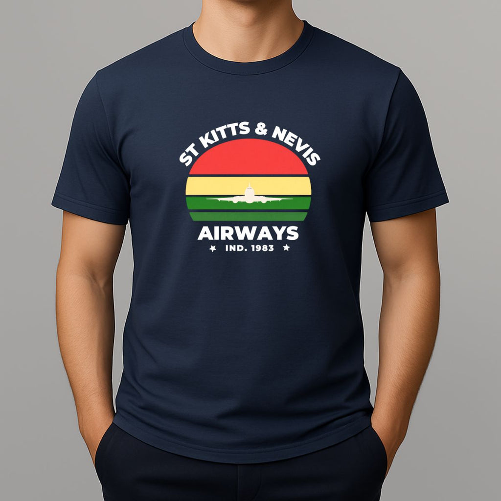 Person wearing a navy t-shirt with a graphic print on the chest, featuring the text 'ST KITTS & NEVIS AIRWAYS' in white, surrounding a circular flag design with red, yellow, and green horizontal bands and a white airplane silhouette.