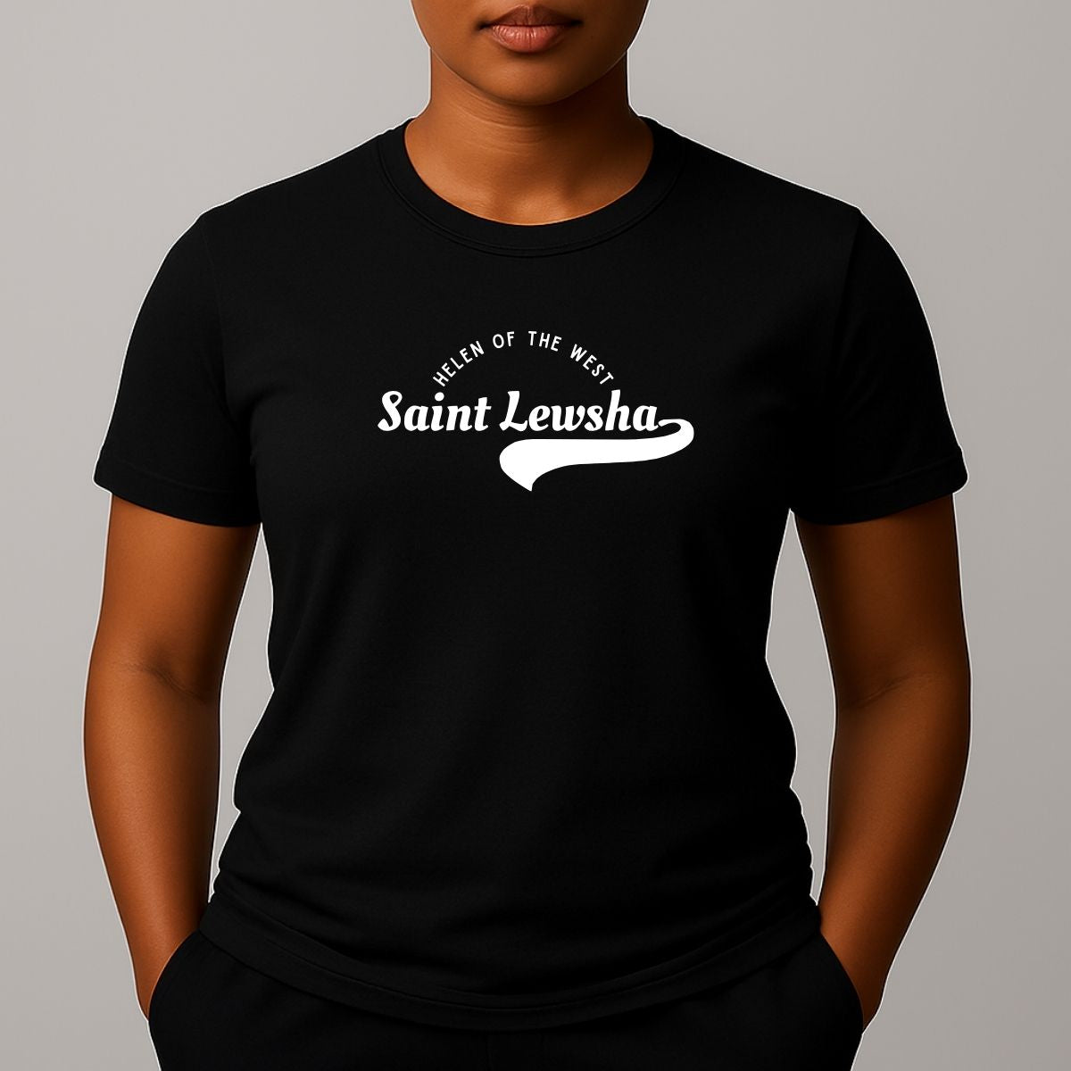 Person wearing a black crewneck t-shirt with a white graphic that reads 'Saint Lewsha' and 'HELEN OF THE WEST' on the chest.