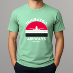 Person wearing a mint green T-shirt with a colorful front graphic that reads "TRINBAYGO AIRWAYS IND. 1962" with an airplane silhouette.