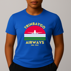 Person wearing a blue T-shirt with a colorful front graphic that reads "TRINBAYGO AIRWAYS IND. 1962" with an airplane silhouette.