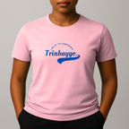 Person wearing a pink t-shirt with a blue graphic print with a phonetic spelling that reads 'Trinbaygo' and 'LAND OF THE HUMMINGBIRD'.