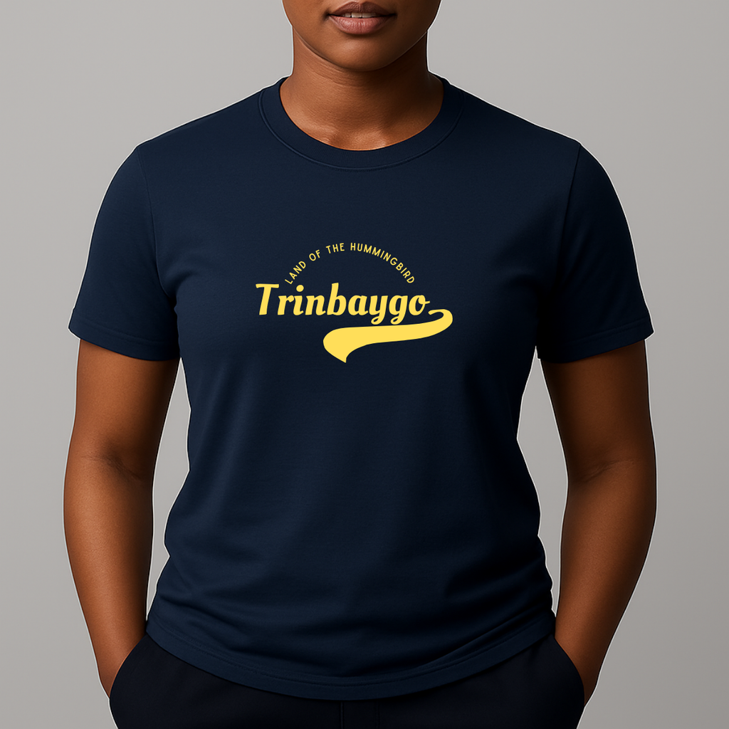Person wearing a navy t-shirt with a yellow graphic print with a phonetic spelling that reads 'Trinbaygo' and 'LAND OF THE HUMMINGBIRD'.