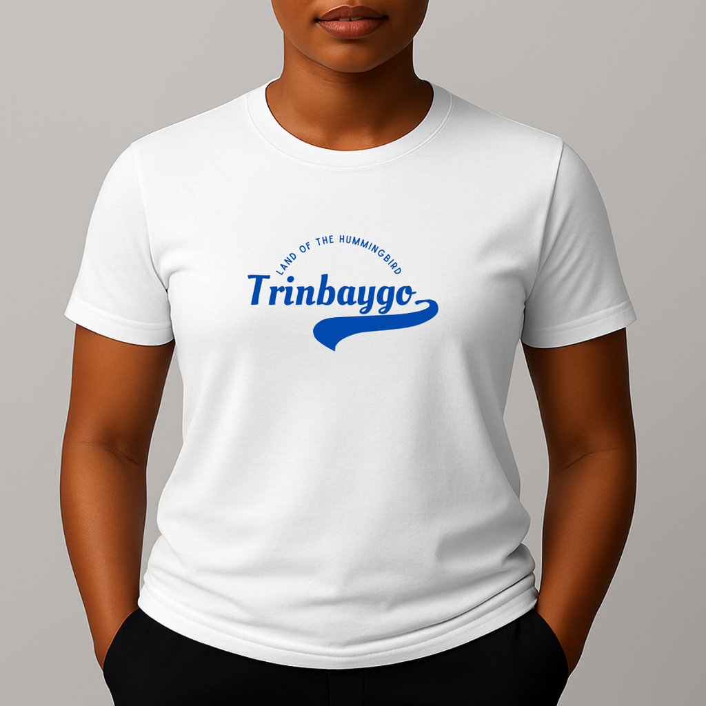 Person wearing a white t-shirt with a blue graphic print with a phonetic spelling that reads 'Trinbaygo' and 'LAND OF THE HUMMINGBIRD'.