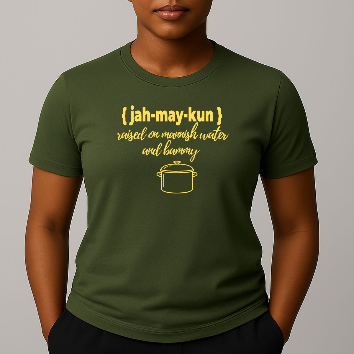 Person wearing a khaki green t-shirt with graphic and text in yellow 'jah-may-kun'