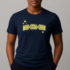 Person wearing a navy t-shirt with 'MUN-STRA-SHUN' printed in yellow on a gray background