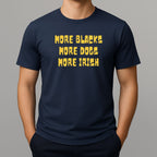 Person wearing a navy t-shirt with yellow text 'MORE BLACKS, MORE DOGS, MORE IRISH' 