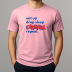 Person wearing a pink t-shirt with a colorful graphic text in blue and red that reads 'eat up drop sleep CARNIVAL repeat.'