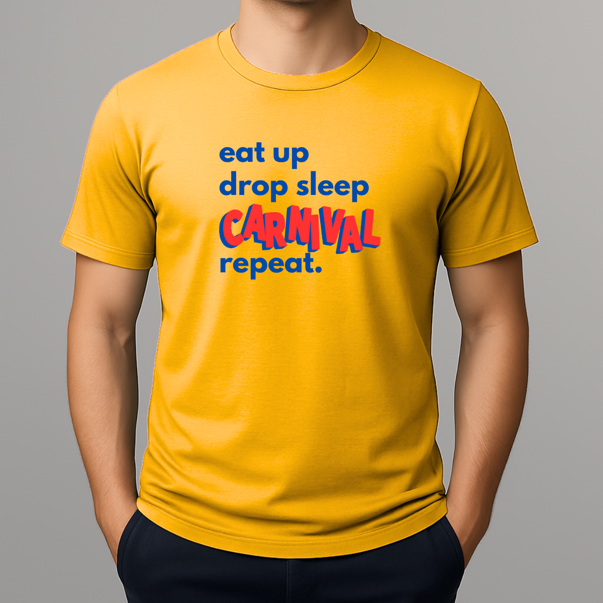Person wearing a yellow t-shirt with a colorful graphic text in blue and red that reads 'eat up drop sleep CARNIVAL repeat.'